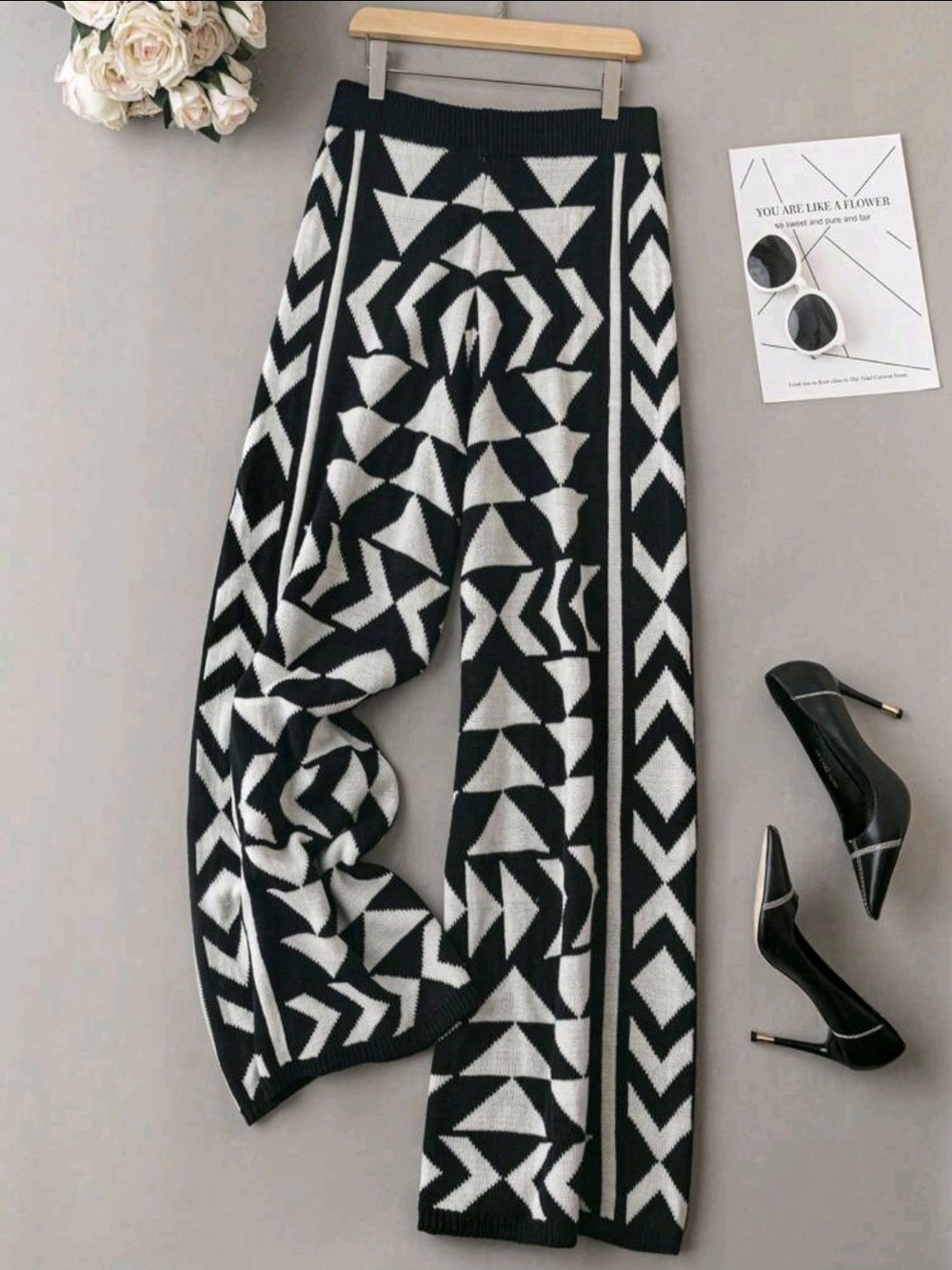 SHEIN black and white patterned knit wide-leg sweater pants.